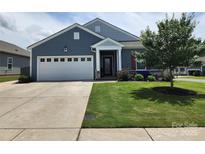 Attractive home featuring a lush lawn and tidy landscaping that enhances its curb appeal at 195 Willow Valley Dr, Mooresville, NC 28115