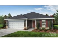 Charming single-story home with a two-car garage, neat landscaping, and a welcoming entrance at 2025 Cunningham Farm Dr, Indian Trail, NC 28079