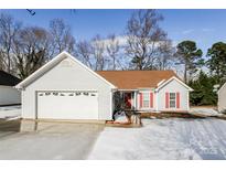 Charming single-story home with attached garage and red shutters, perfect for any Gathering at 676 Rebecca Jane Dr, Mooresville, NC 28115