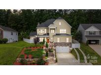 Charming two-story home with manicured landscaping and a two-car garage at 2117 Middlebridge Ct, Fort Mill, SC 29715