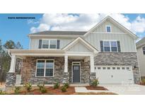 Charming two-story home featuring stone accents and a welcoming front porch at 248 Miramar Dr, York, SC 29745