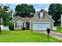 Charming single-Gathering home featuring a two-car garage and a well-maintained front yard at 406 Courtland Ct, Kannapolis, NC 28081