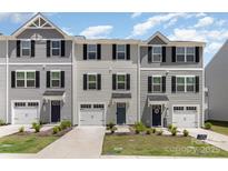 Charming townhomes showcase appealing exteriors with individual garages and inviting front entrances at 5690 Granbury Dr, Kannapolis, NC 28081