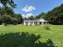 Charming single-story home with well-maintained lawn and inviting front porch at 8122 Hutchison Ln, Vale, NC 28168