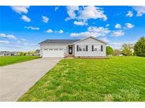 Charming single-story home with lush green lawn and attached two car garage at 103 Chambwood Ln, Shelby, NC 28152