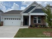 Charming single-story home with a two-car garage and well-manicured lawn at 156 Ella Claire Dr, York, SC 29745