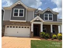 Charming two-story home with a brick and gray siding exterior and a two-car garage at 160 Ella Claire Dr, York, SC 29745