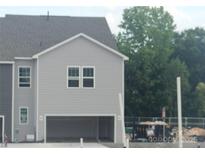 New two-story home featuring gray siding and an attached two-car garage at 4143 Walking Ridge Rd # 49, Charlotte, NC 28208