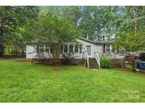 Charming one-story home with a well-maintained front yard, mature trees, and light gray siding at 4921 Sierra Dr, Maiden, NC 28650