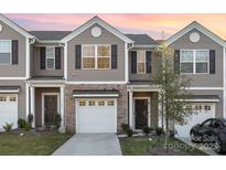 Charming townhouse with a modern exterior and well-maintained landscaping at 7109 N Mills Rd, Charlotte, NC 28216