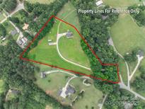 Aerial view of property with clearly marked boundary lines and winding driveway on a lush, green lot at 1347 Norman Dr, Rock Hill, SC 29732