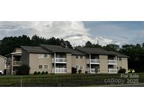 A multi-Gathering condo with private balcony and mature trees creating a park-like setting at 140 Lake Concord Ne Rd, Concord, NC 28025