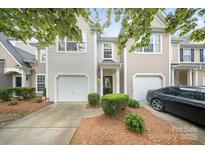 Charming townhouse with well-maintained landscaping and a single-car garage at 14664 Lions Paw St, Charlotte, NC 28273