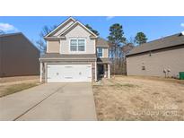 Charming two-story home featuring a two-car garage and a well-maintained lawn at 3735 Ernie Dr, Charlotte, NC 28269