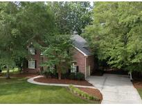 Charming brick home with lush landscaping and a winding driveway, offering curb appeal at 1587 Summit View Dr, Rock Hill, SC 29732
