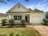 Charming single-story home with a well-manicured lawn and inviting front porch at 2010 Kansas City Dr, Monroe, NC 28110