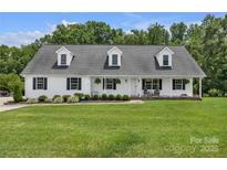Charming single-story home with a welcoming front porch and well-manicured lawn at 247 Helton Rd, Cherryville, NC 28021