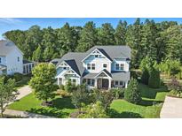 Charming two-story home featuring a stone facade and well-manicured landscaping at 1908 Masons Bend Dr, Fort Mill, SC 29708