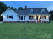 Charming two-story home with a well-manicured lawn and covered porch at 250 Wesley Amaker Rd, York, SC 29745