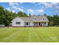 Charming home featuring a landscaped yard, covered porch, and classic architectural details at 250 Wesley Amaker Rd, York, SC 29745