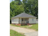 Charming one-story home with a covered porch and a well-maintained front yard at 411 Klumac Rd, Salisbury, NC 28144