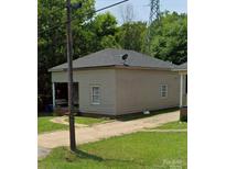 Charming single-story home featuring neutral siding, a concrete driveway, and a cozy covered front porch at 413 Klumac Rd, Salisbury, NC 28144