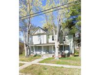 Charming two-story home with a inviting front porch perfect for enjoying the outdoors at 500 7Th St, Spencer, NC 28159