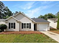 Charming single-story home featuring light siding, black shutters, and an attached one-car garage at 8219 Pozzi Rd, Charlotte, NC 28216