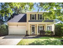 Charming two-story home featuring a two-car garage and manicured lawn at 9808 Steed Ct, Charlotte, NC 28269