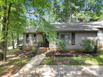 Charming single story home with a well maintained yard and mulched flower beds with stone border at 1003 Cranberry Cir, Fort Mill, SC 29715