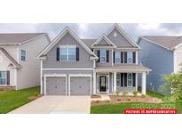 Charming two-story home featuring a two-car garage and landscaped front yard at 112 Fordingbridge Ln, Mooresville, NC 28115