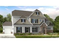 A beautifully designed two-story home with stone accents and a welcoming front porch and attached two car garage at 18126 Sulton Ter, Huntersville, NC 28078