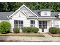 Charming home featuring a light exterior, well-maintained landscaping, and bright windows at 409 Lexie Ln, Rock Hill, SC 29732