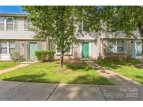 Townhouses with trees in front on a sunny day at 5226 Fair Wind Ln, Charlotte, NC 28212