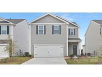 Charming two-story home featuring a two-car garage and gray siding, perfect for modern living at 1043 20Th Avenue Se Loop, Hickory, NC 28602