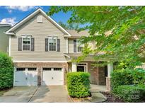 Charming two-story home with a two-car garage and a welcoming front porch at 11538 Ardrey Crest Dr, Charlotte, NC 28277