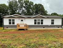 Charming single-story home with white siding and a welcoming front porch at 130 Zircon Dr, Statesville, NC 28625