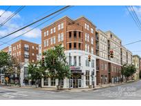 Corner building featuring classic brickwork, modern storefronts, and pedestrian-friendly streetscape at 1315 East Blvd, Charlotte, NC 28203