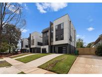 Contemporary townhouse exteriors feature modern design, gray and white paneling, and well-manicured lawns at 213 Keswick Ave, Charlotte, NC 28206