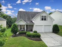 Charming two-story home with landscaped yard, attached two-car garage, and inviting front porch at 3908 Parkers Ferry Rd, Fort Mill, SC 29715