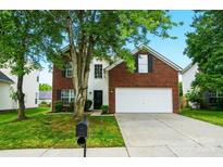 Charming two-story brick home features a well-manicured lawn and inviting curb appeal at 4982 Bentgrass Run Dr, Charlotte, NC 28269