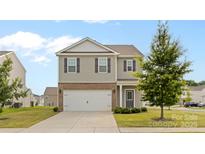 Two-story home featuring a gray facade, a two-car garage, and a well-maintained front lawn at 331 Gaines Rd, Clover, SC 29710