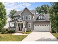 Charming two-story home with attached two-car garage and inviting front porch at 124 Slocumb Ln, Mooresville, NC 28117