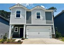 Two-story home featuring gray and white siding, a two-car garage, and a well-maintained front yard at 1426 31St Ne St, Conover, NC 28613