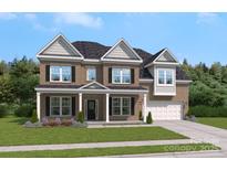 Beautiful two-story brick home with covered front porch and well-manicured lawn at 204 Coronado Ave, Matthews, NC 28104