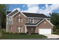 Charming two-story brick home with attached two car garage and landscaped front yard at 308 Alameda Way, Matthews, NC 28104