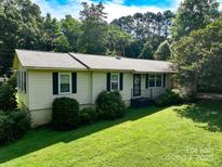 Charming single story home with a well-manicured lawn and mature trees at 4022 Price Short Cut Rd, Monroe, NC 28110