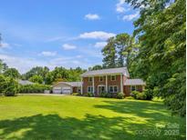 Beautiful two-story brick home with a manicured front lawn and a detached two car garage at 1252 Wendy Rd, Rock Hill, SC 29732