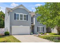 Charming two-story home featuring gray siding, a two-car garage, and a well-maintained front yard at 2090 Durand Rd, Fort Mill, SC 29715