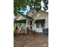 Charming single-story home with a welcoming front porch and awnings at 3220 Harmony Hwy, Harmony, NC 28634